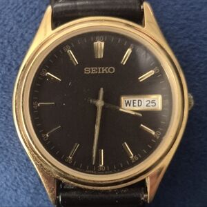 Seiko Gold and Black Dress Watch with Day-Date